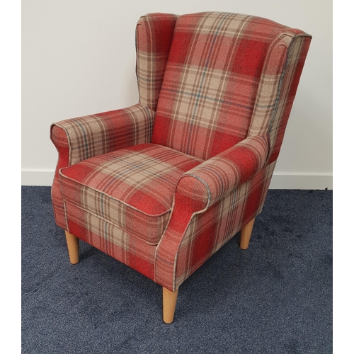 396 - MODERN ARMCHAIR
covered in a red plaid material with scroll arms above a padded seat, standing on tu... 