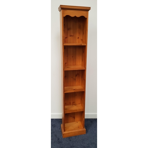 405 - WAXED PINE BOOKCASE
of narrow proportions with a moulded top and shaped frieze above five shelves, s... 