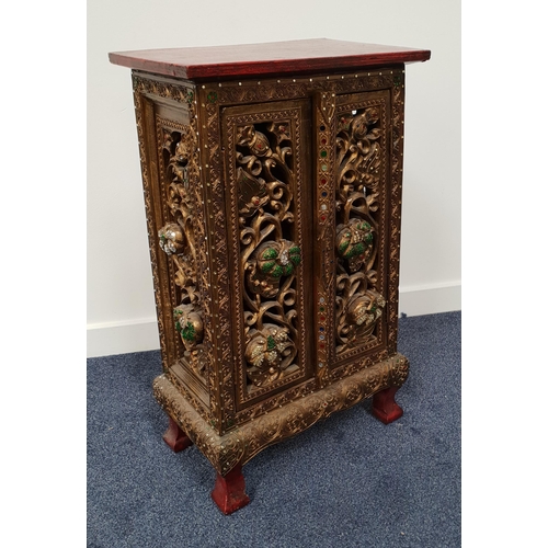 406 - CARVED AND PAINTED EAST ASIAN SIDE CABINET
with a rectangular red painted top above a pair of elabor... 