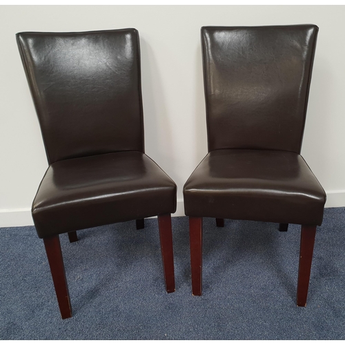 407 - PAIR OF BROWN LEATHER DINING CHAIRS
with high padded backs and seats, standing on tapering supports ... 