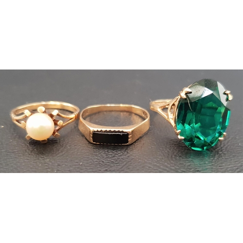 96 - THREE NINE CARAT GOLD RINGS
one set with faceted green glass, another with pearl and the last with b... 