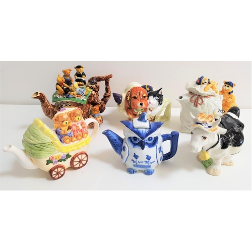 167 - SIX NOVELTY TEAPOTS
comprising cat and dog, the wise owl, teddy bear's picnic, a cow, teddy bears in... 