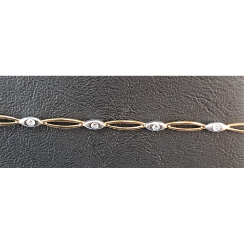 93 - CZ SET NINE CARAT TWO TONE GOLD BRACELT
with alternating pierced yellow gold and CZ set white gold l... 