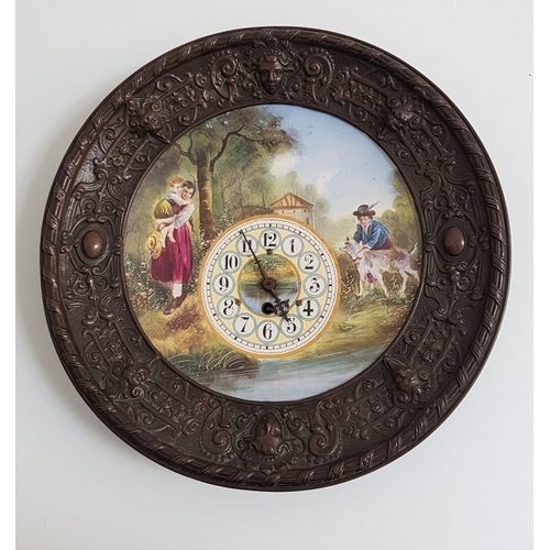 189 - DECORATIVE WALL CLOCK
with a central painted panel depicting figures by a stream in a metal surround... 