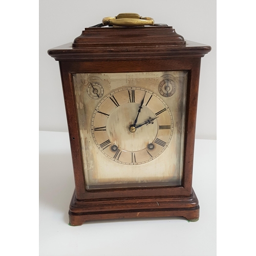 224 - WINTERHALDER & HOFMEIER MANTLE CLOCK
in a mahogany case with four bevelled glass panels, the silvere... 