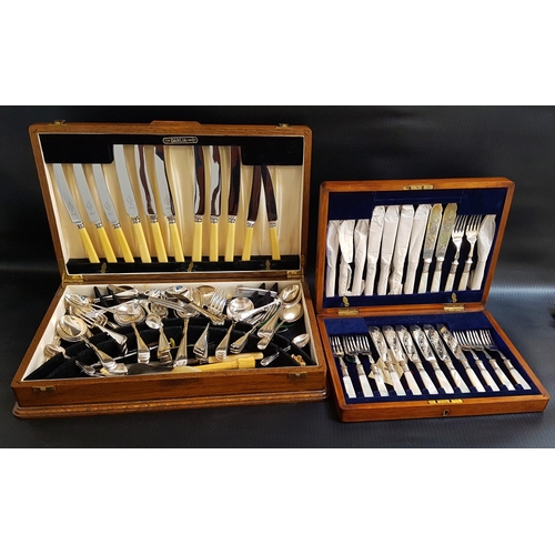 230 - OAK CASED CANTEEN OF FISH KNIVES AND FORKS
with Mother of Pearl handles, for twelve settings, togeth... 