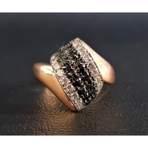 88 - BLACK AND WHITE CZ SET DRESS RING
on fourteen carat gold shank with shaped setting, ring size Q-R an... 