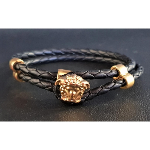 91 - VERSACE MEDUSA BRACELET
with double braided leather bracelet and gold tone hardware