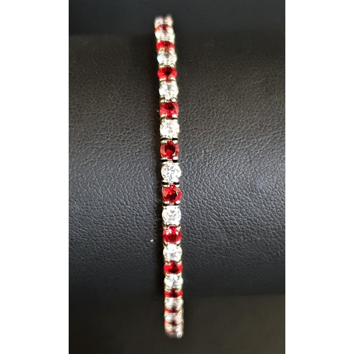 95 - RED AND WHITE CZ SET LINE BRACELET
in silver, approximately 18cm long