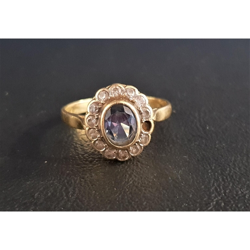 97 - BLUE TOPAZ AND CLEAR GEM SET CLUSTER RING
the central oval cut blue topaz approximately 1ct in bezel... 