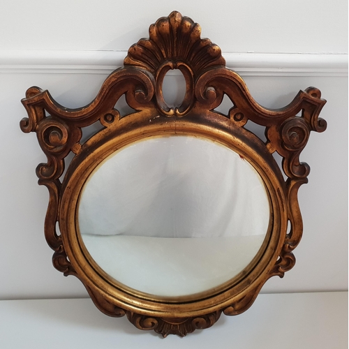 363 - CONVEX WALL MIRROR
with a circular plate in a carved and pierced frame, 78cm high