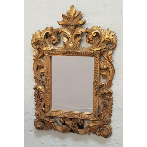 366 - COMBINATION WALL/DRESSING TABLE MIRROR
with a plain rectangular plate and a carved and pierced giltw... 