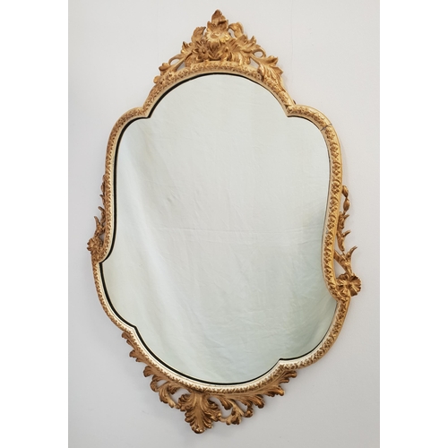 370 - DECORATIVE SHAPED WALL MIRROR
in a painted metal frame with gilt highlights, 81cm high