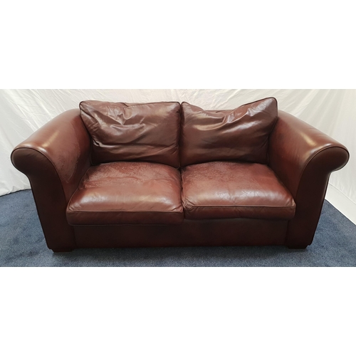 417 - LARGE LEATHER TWO SEAT SOFA
in brown leather with loose seat and back cushions and scroll arms, stan... 