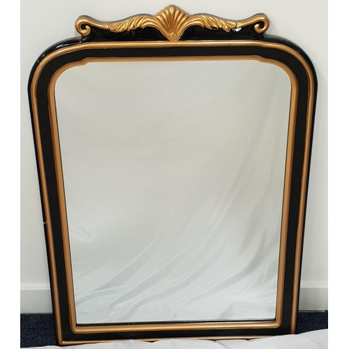 428 - ARCHED OVERMANTLE MIRROR
in an ebonised and gilt frame, 91cm x 66cm