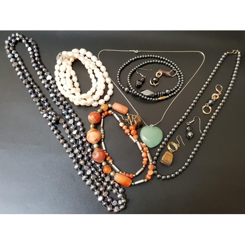 33 - SELECTION OF JEWELLERY
including two pearl necklaces, one white and one black, a jade coloured hards... 