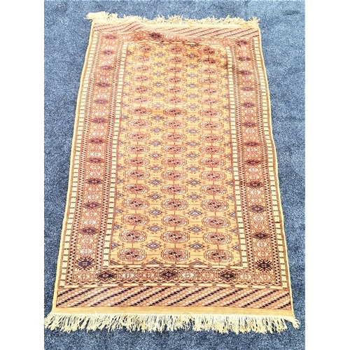 515 - BAKHARA RUG
with a green ground decorated with geometric motifs, fringed, 165cm x 99cm