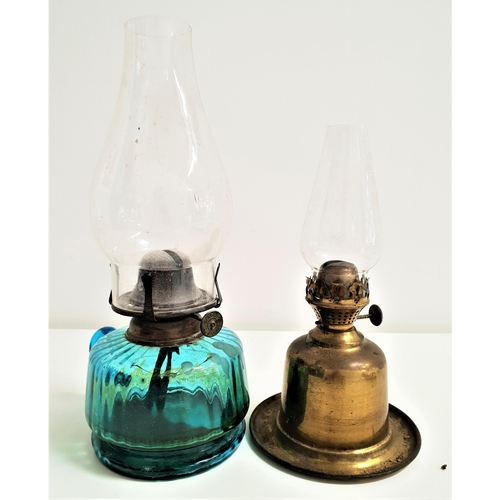 291 - VINTAGE GLASS OIL LAMP
the blue ribbed glass reservoir with handle and a clear glass stack, 30.5cm h... 