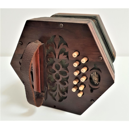 406 - 19th CENTURY ROSEWOOD CONCERTINA
marked Campbells of Glasgow to a paper label, with ten buttons to e... 