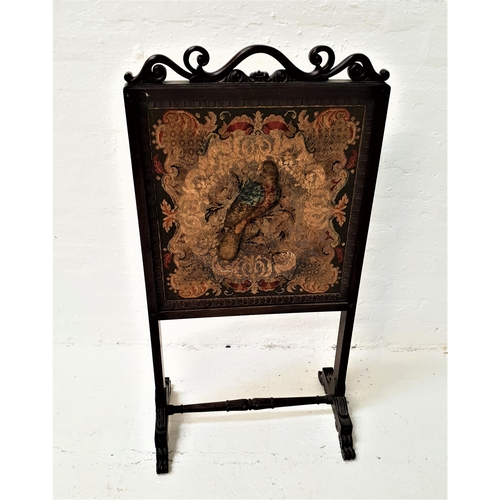 510 - VICTORIAN ROSEWOOD FIRESCREEN
with an embroidered panel depicting a central raised bird encased by a... 