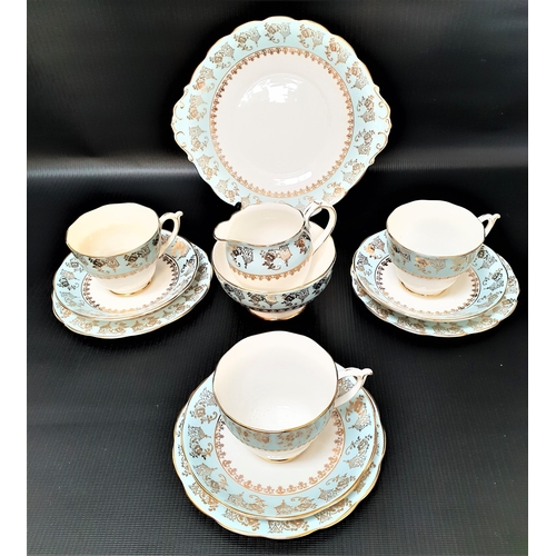 171 - ROSLYN TEA SERVICE
with a white ground and light blue and gilt highlights, comprising cups and sauce... 