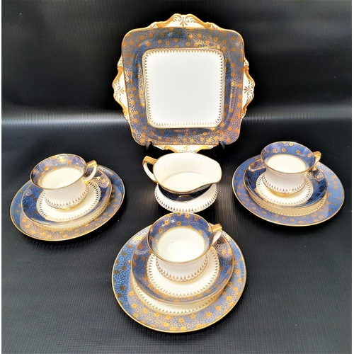 172 - PARAGON TEA SERVICE
with a white ground and light blue border with gilt flowers, comprising cups and... 