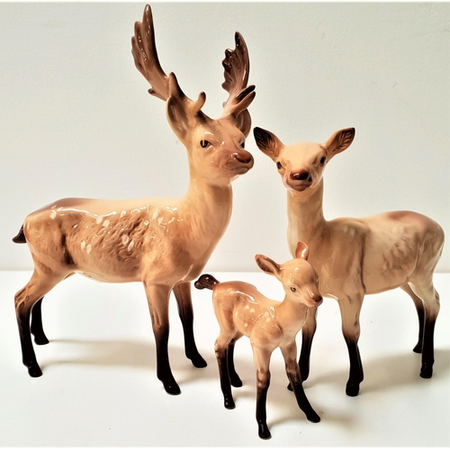 221 - BESWICK DEER GROUP
comprising a stag, 19.5cm high, hind, 14.5cm high and a fawn, 9.5cm high (3)