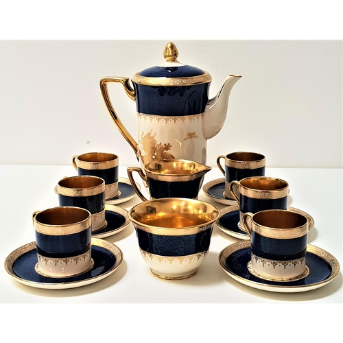 230 - CROWN DEVON FIELDINGS COFFEE SET
decorated in blue and gilt, the cups, milk jug and sugar bowl with ... 