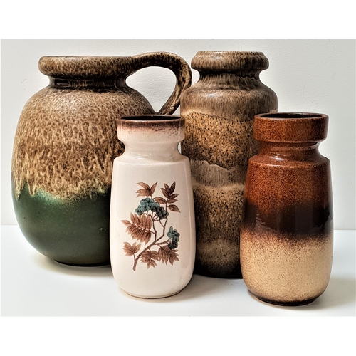 239 - THREE WEST GERMAN POTTERY VASES
22cm, 22.5cm and 29.5cm high, together with a similar West German po... 