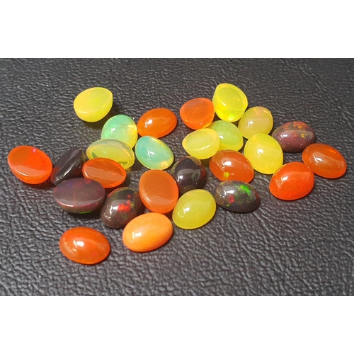 84 - CERTIFIED LOOSE NATURAL MULTI COLOUR FIRE OPALS
the oval cabochon cut loose fire opals weighing 21.2... 