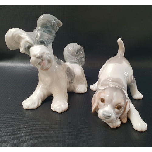 258 - TWO LLADRO DOG FIGURINES
one depicting a puppy, 15cm long, the other a terrier, 15cm long (2)