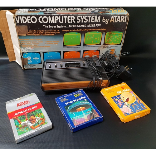 423 - ATARI COMPUTER GAMES SYSTEM
with power lead, joystick and three classic games - Space Invaders, Pac-... 