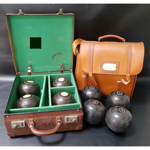 417 - SET OF THOMAS TAYLOR LIGNOID LAWN BOWLS
in a carry case, together with a set of Dunlop Australian la... 