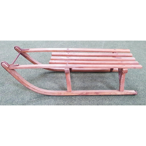 444 - CHILDRENS VINTAGE WOODEN SLEDGE
with a slatted body and shaped runners