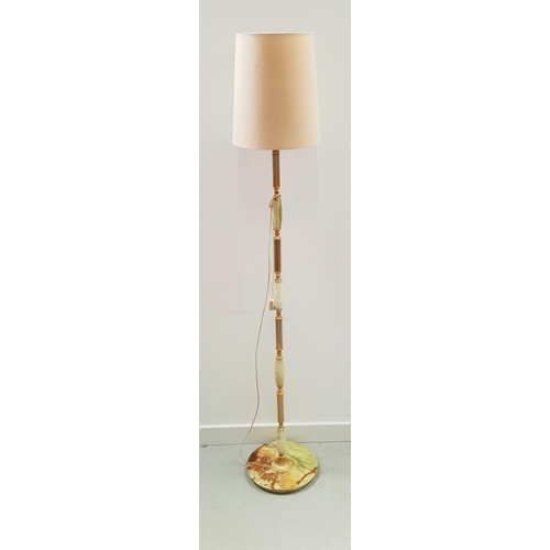 574 - ONYX AND GILT BRASS STANDARD LAMP
raised on a circular base with a column of onyx and brass, with a ... 