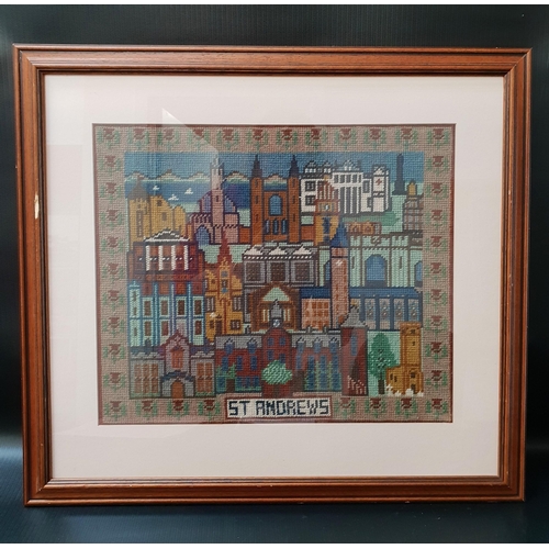 492 - ST. ANDREWS NEEDLEWORK PICTURE
depicting the sights of the historic town, framed and glazed, 36cm x ... 