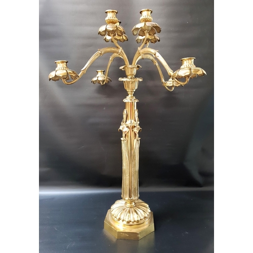 592 - ORNATE BRASS CANDLEABRA
raised on an octagonal base, the column modelled as flowers with four centra... 