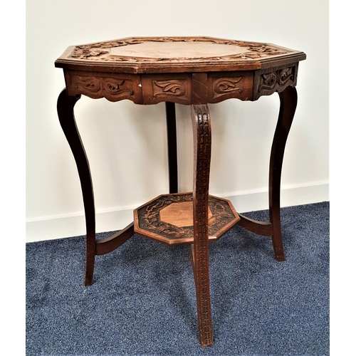 584 - EDWARDIAN OAK WINDOW TABLE
with a carved octagonal top decorated with fruiting vines, standing on sh... 