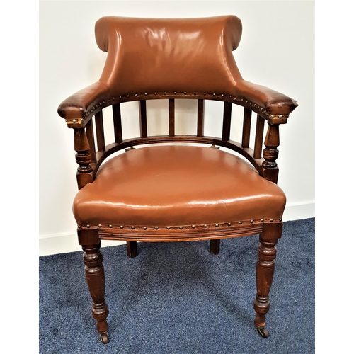 588 - CAPTAINS ARMCHAIR
with a shaped and padded top rail above a lower spindle section, with a shaped pad... 