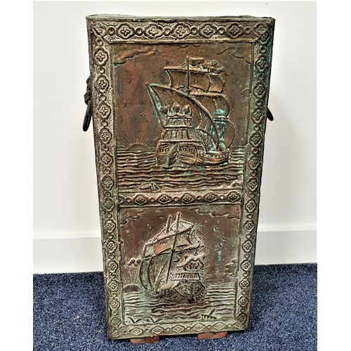 589 - EMBOSSED BRASS STICK STAND
decorated with a nautical scene, with lion mask handles, 55cm high