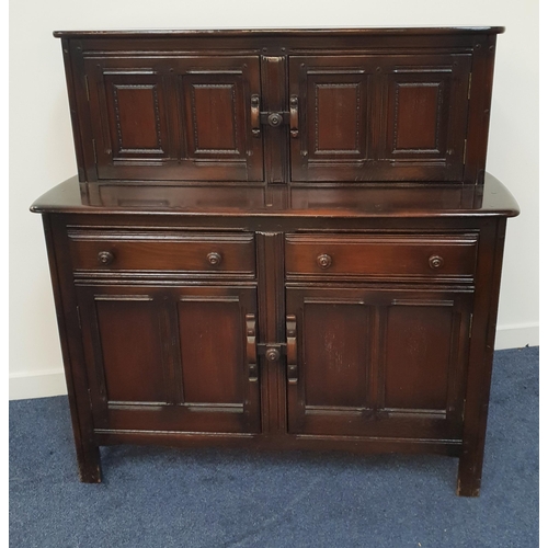 569 - OAK DRESSER
with a moulded top above two panelled cupboard doors, the base with two frieze drawers a... 