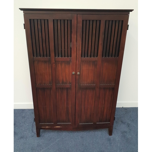 576 - CHINESE STYLE TEAK CABINET
with a pair of panelled and part slatted doors opening to reveal two slid... 