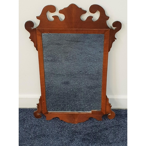 586 - 19th CENTURY FRET CARVED MAHOGANY WALL MIRROR 
with a rectangular plate, 74cm high