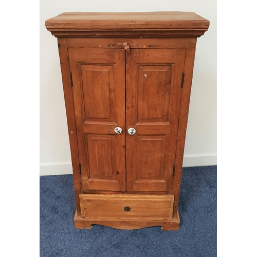 598 - TEAK CUPBOARD
with a moulded top above a pair of panelled doors opening to reveal a shelved interior... 