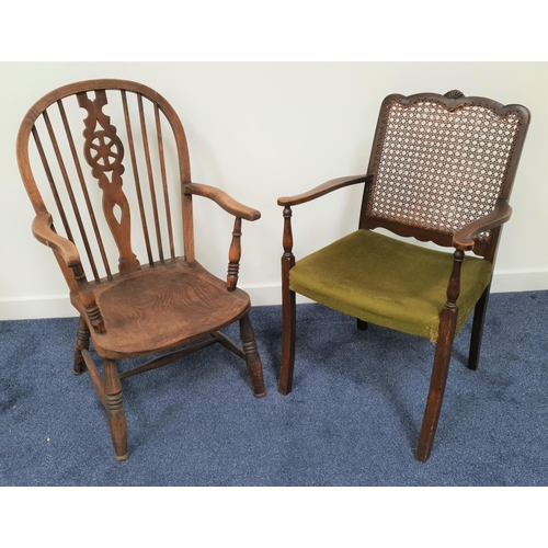 607 - OAK AND ELM WHEELBACK CARVER CHAIR
with an arched spindle back above a shaped seat, standing on turn... 