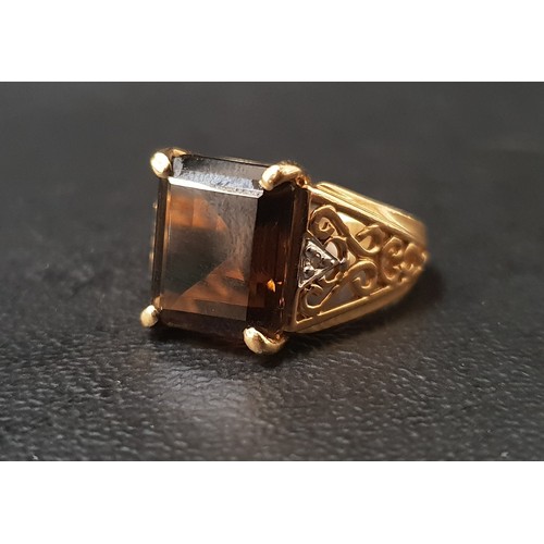 82 - SMOKY TOPAZ AND DIAMOND SET DRESS RING
the rectangular step cut topaz flanked by decorative pierced ... 