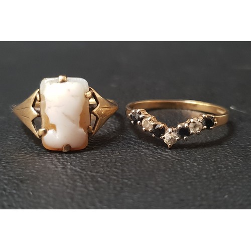 83 - TWO NINE CARAT GOLD RINGS
one with a small cameo and the other a wishbone ring set with sapphire and... 