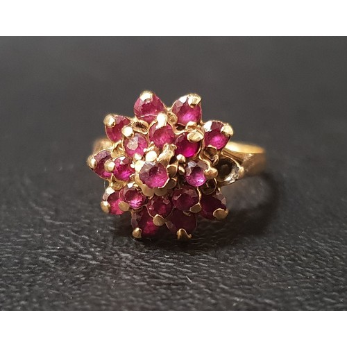 89 - RUBY CLUSTER RING
on unmarked gold shank with stepped setting, ring size L-M