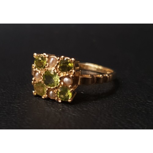 102 - PERIDOT AND SEED PEARL CLUSTER RING
the five peridots interspersed with seed pearls, on nine carat g... 