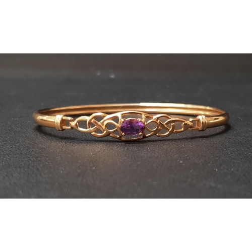 98 - AMETHYST SET NINE CARAT GOLD BANGLE
the oval cut amethyst in pierced setting, approximately 5.5 gram... 